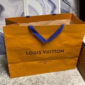 Large Louis Vuitton Empty Shopping Bag. Great condition. Blue handles orange box